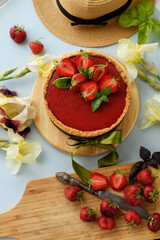 Cold cheesecake with strawberry jelly.