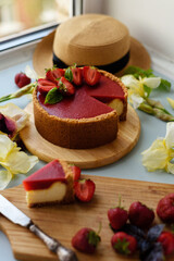 Cold cheesecake with strawberry jelly.