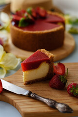 Cold cheesecake with strawberry jelly.