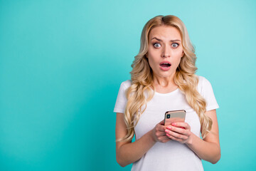 Portrait of frustrated anxious nervous girl use smart phone read social network notification corona virus information impressed wear good look clothes isolated over teal color background