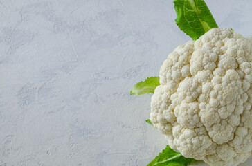 The head of the useful cauliflower on a light background. Useful food concept. Horizontal oriental,...