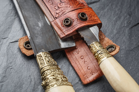 Details of a traditional handmade  balinese knife belakas on a slate background