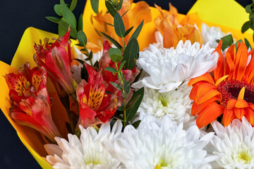 Fragment bouquet of different flowers. Floral close-up, background and texture