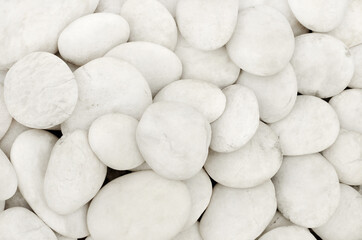 Fototapeta na wymiar Close up natural white pebbles, texture of decorative stone gravel.