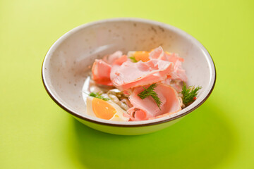 Boiled eggs with smoked ham and vegetables. Healthy vegetarian diet. Veggies salad.