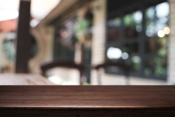 Blurred background of home garden picnic and wooden table free space for product display.