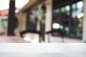 Blurred background of home garden picnic and wooden table free space for product display.