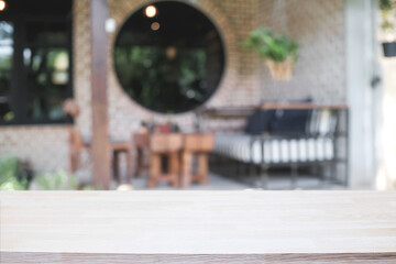 Blurred background of home garden picnic and wooden table free space for product display.