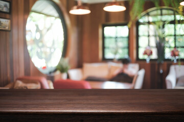 Empty wooden table space platform and blurred restaurant or coffee shop background for product display montage.