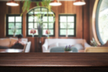Empty wooden table space platform and blurred restaurant or coffee shop background for product display montage.