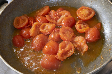sauteed cherry tomatoes in pan