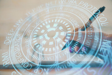 Double exposure of writing hands on background with data solution hologram on front. Technology concept. Close up