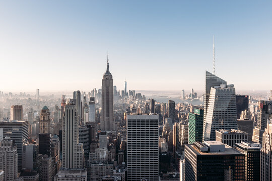 Panoramic View Of Midtown And Lower Manhattan With The Empire State Building In New York City From The Top Of The Rock Observation Deck