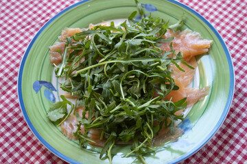 slices of smoked salmon with rocket