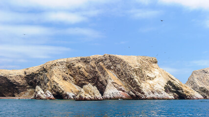 Fototapeta na wymiar It's Landscape of the rocks over the sea of the Ballestas Island