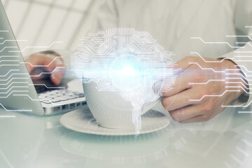 Man with computer background with brain theme hologram. Concept of brainstorm. Double exposure.