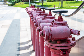 Fototapeta na wymiar A row of outdoor fire hydrants in a residential area