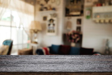 Wooden desk space platform and blurred restaurant or coffee shop background for product display montage.