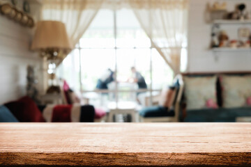 Empty wooden table space platform and blurred restaurant or coffee shop background for product display montage.
