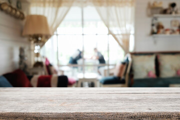 Empty wooden table space platform and blurred restaurant or coffee shop background for product display montage.