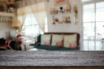 Empty wooden table space platform and blurred restaurant or coffee shop background for product display montage.