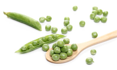 Green peas with pods and wooden spoon isolated on white background