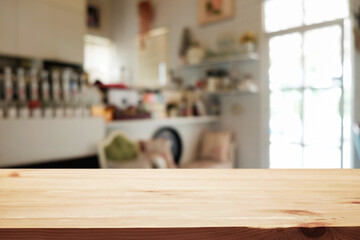 Empty wooden table space platform and blurred restaurant or coffee shop background for product display montage.