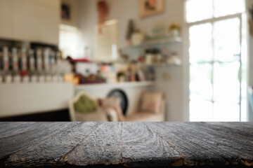 Empty wooden table space platform and blurred restaurant or coffee shop background for product display montage.