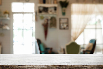 Empty wooden table space platform and blurred restaurant or coffee shop background for product display montage.