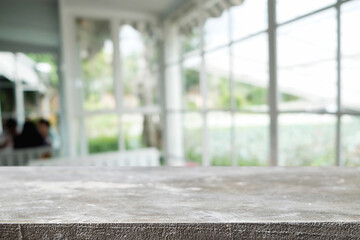 Empty wooden table space platform and blurred restaurant or coffee shop background for product display montage.
