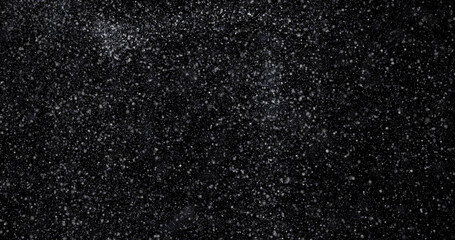 abstract Flying dust particles on a black background