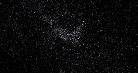 abstract Flying dust particles on a black background
