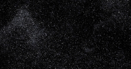 abstract Flying dust particles on a black background