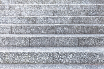 Grey rough stone stairs at the park