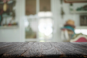 Empty wooden table space platform and blurred restaurant or coffee shop background for product display montage.