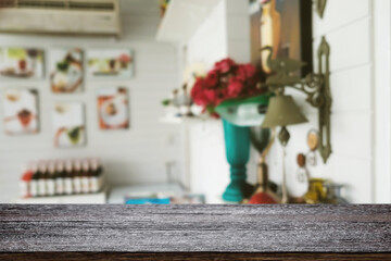 Empty wooden table space platform and blurred restaurant or coffee shop background for product display montage.