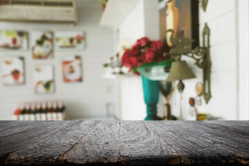 Empty wooden table space platform and blurred restaurant or coffee shop background for product display montage.