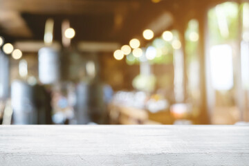 Empty wooden table space platform and blurred restaurant or coffee shop background for product display montage.