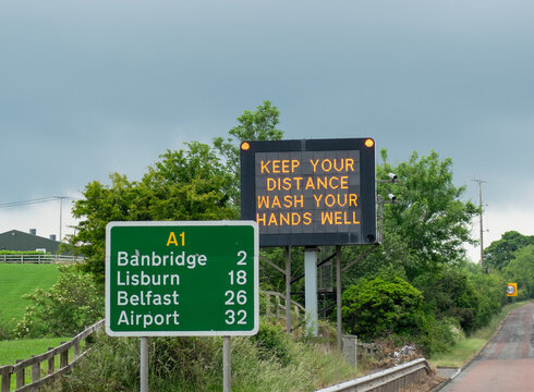 COVID 19 Sign Keep Your Distance Wash Your Hands Well On The Motorway Highway Dublin To Belfast