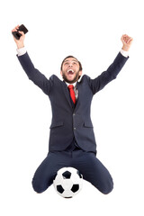 Happy businessman with football