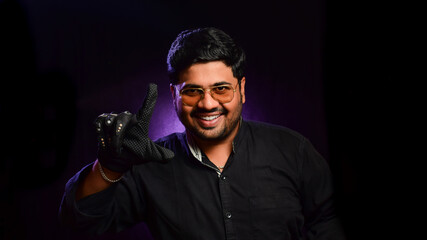 Crazy cool biker man feeling happy and excited in sunglasses