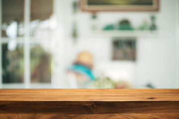 Empty wooden table space platform and blurred resturant or coffee shop background for product display montage.