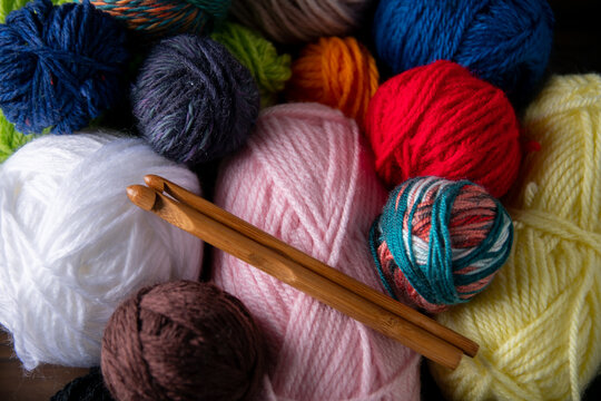 Yarn balls and crochet needles.