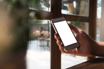 Women's hands holding cell telephone blank copy space screen. smart phone with technology concept.