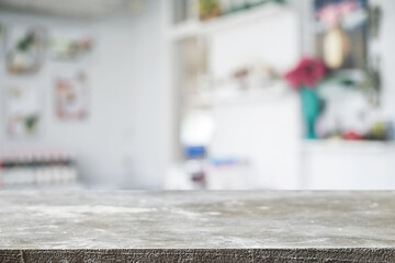 Empty wooden desk space platform over blurred restaurant or coffee shop background for product display montage.