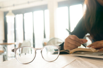 Woman working in cafe wearing protective mask. coronavirus COVID-19 Social distancing keep distance in public society people to protect COVID-19