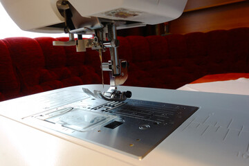 Modern sewing machine at home