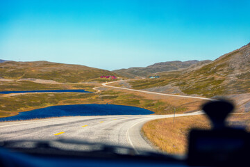 Driving a car in the tundra in summer. Arctic lakes. View from the windshield. Wildlife of Norway. North Cape, Mageroya Island