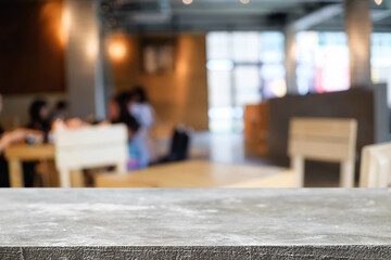 Empty wooden table space platform and blurred restaurant or coffee shop background for product display montage.