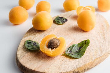 Close-up of ripe peaches on the table. Ripe peaches with leaves